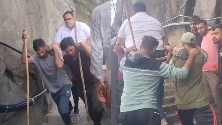 VIDEO: Tourists pay local porters to carry them up 10,000 steps